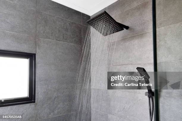 shower in a luxury bathroom - shower head stock pictures, royalty-free photos & images