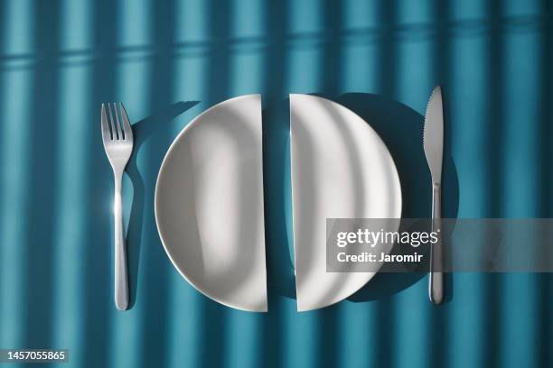 two half of broken plate on table - empty table for two stock pictures, royalty-free photos & images