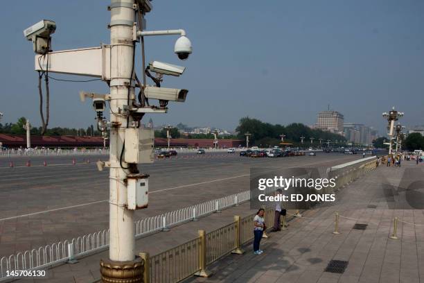 Security cameras rise above Chang'an avenue on Tiananmen Square in Beijing on June 4, 2012 on the 23rd anniversary of China's crackdown of democracy...