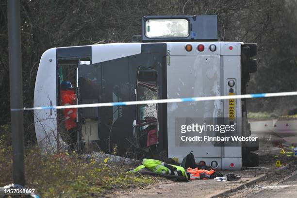 Police at the scene after an early-morning crash involving a double-decker bus on January 17, 2023 near Cannington, Somerset, England. The bus was...