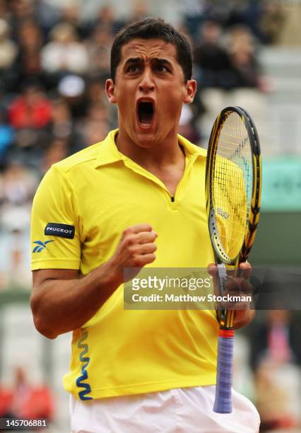 Nicolas Almagro of Spain celebrates in his men's singles fourth round match against Janko Tipsarevic of Serbia during day 9 of the French Open at...