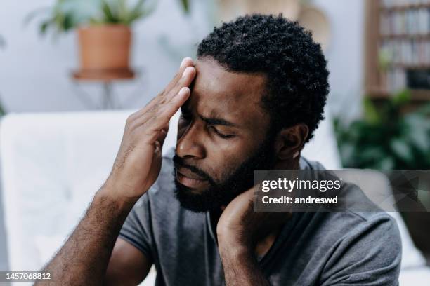 man with headache and neck pain - head injury stock pictures, royalty-free photos & images