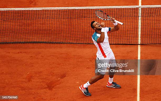 Jo-Wilfried Tsonga of France celebrates victory in his men's singles fourth round match against Stanislas Wawrinka of Switzerland during day 9 of the...