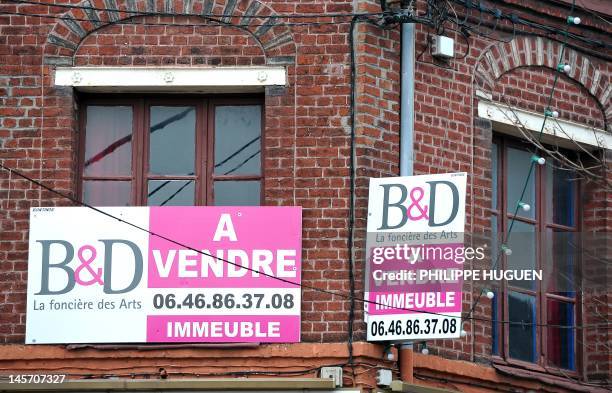 An old building on sale on January 30, 2012 in Lille, northern France. The French construction industry is set to shed 35,000 jobs next year because...