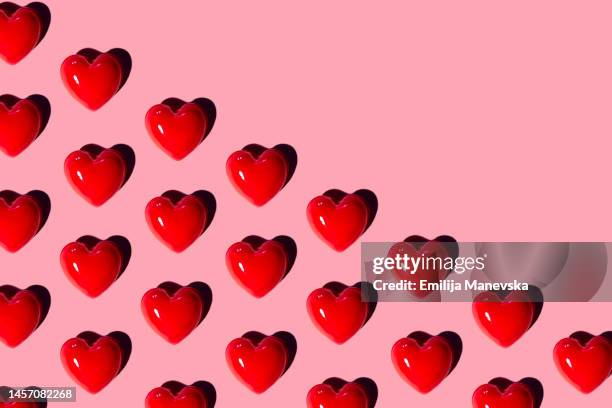 red hearts background - candy hearts stock pictures, royalty-free photos & images