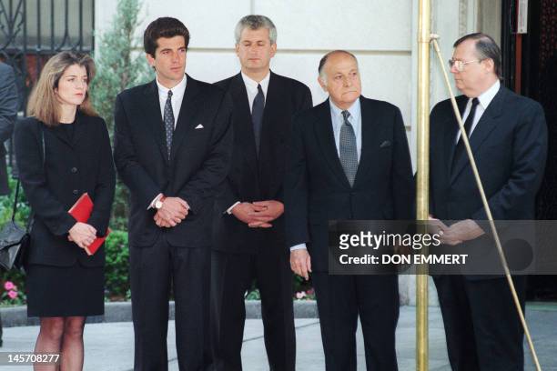 Caroline Kennedy Schlossberg, John F. Kennedy Jr., Edwin Scholssberg and Maurice Tempelsman watch as the casket containing the body of Jacqueline...