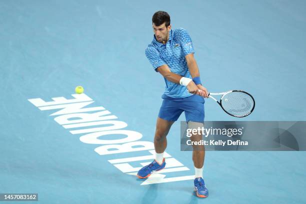 Novak Djokovic of Serbia plays a backhand in their round one singles match against Roberto Carballes Baena of Spain during day two of the 2023...