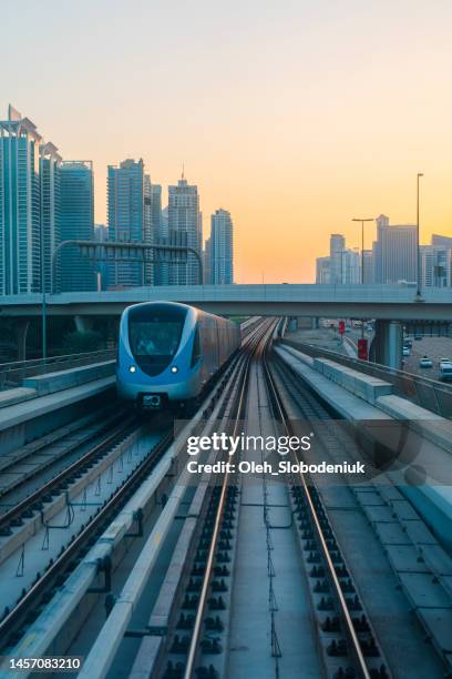 dubai metro at sunset - railway tracks sunset stock pictures, royalty-free photos & images