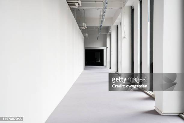 long corridor in modern office building - hall ストックフォトと画像