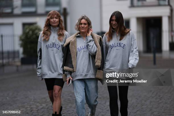 Nadine Berneis seen wearing a black short Bershka leggings, Bottega Veneta black boots, grey HERNAMEIS the label sweater and a black mini Prada...