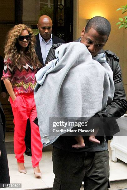 Beyonce, Jay Z and their baby Blue Ivy Carter leave the 'MEURICE' hotel on June 4, 2012 in Paris, France.