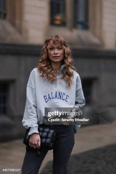 Nadine Berneis seen wearing beige aeyde boots, black Black Palms the labels pants and a grey HERNAMEIS the label sweater and a black Bottega Veneta...