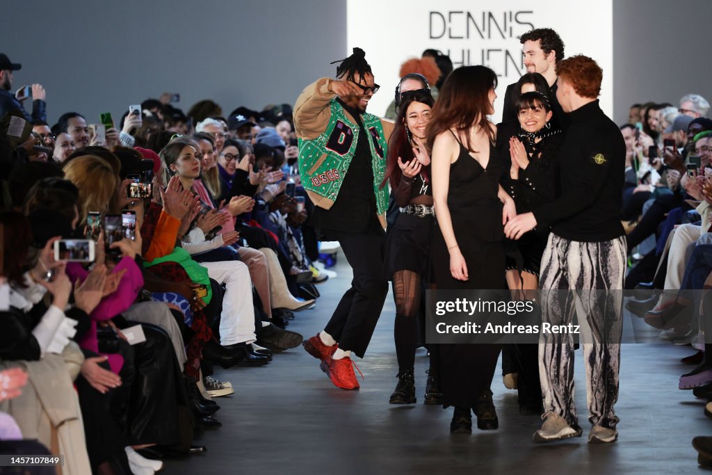Designer Dennis Chuene responds to the applause of the audience on ...