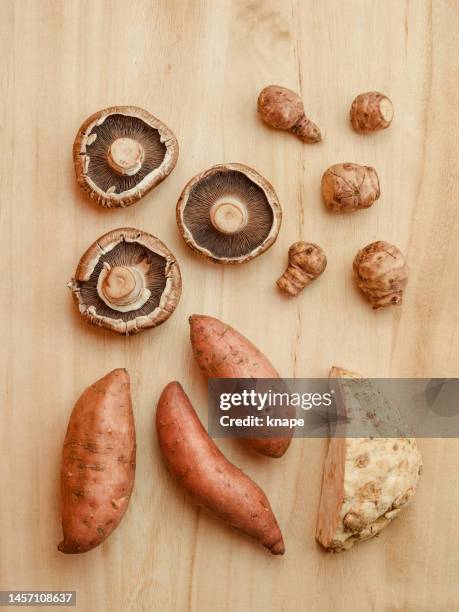 sweet potato portobello mushroom and healthy vegetables still life - celeriac stockfoto's en -beelden