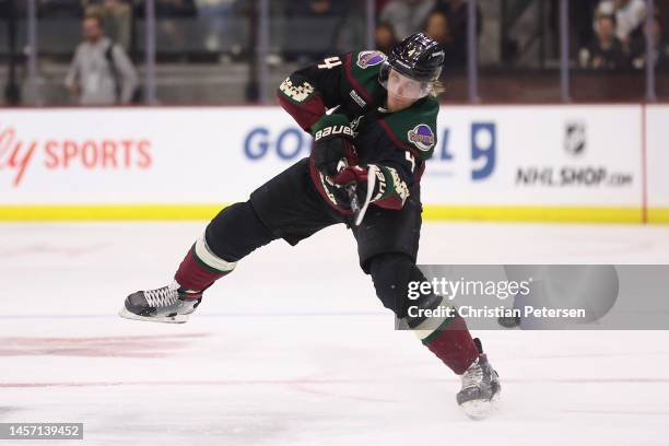 Juuso Valimaki of the Arizona Coyotes dumps the puck during the NHL game at Mullett Arena on January 10, 2023 in Tempe, Arizona. The Sharks defeated...