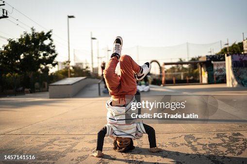 Portrait of child boy breakdancing at skateboard park Portrait of child boy breakdancing at skateboard park