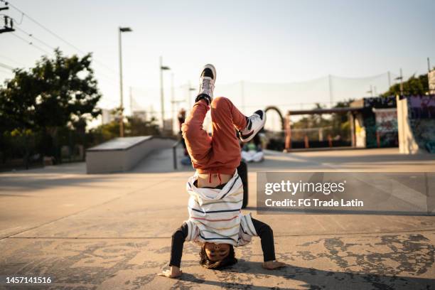 portrait of child boy breakdancing at skateboard park - fab fragment stock pictures, royalty-free photos & images