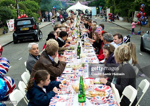 Lunch is enjoyed at a street party in Kensington during the Queen's Diamond Jubilee celebrations on June 4, 2012 in London, England. For only the...