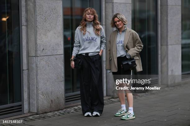 Nadine Berneis seen wearing p&c x Annkathrin Götze black pants and Victoria Thomas seen wearing beige Blazer from The Frankie Shop, a black short...