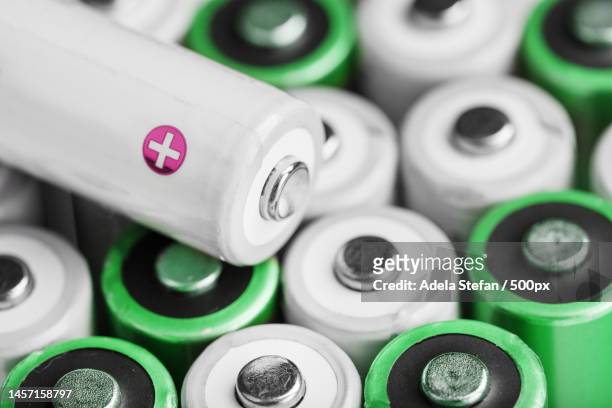 rechargeable aa batteries with white and positive polarity,romania - alkaline stockfoto's en -beelden