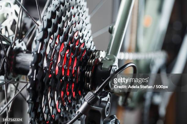 black bicycle 11-speed cassette with switch and chain close-up,accessories for bike repair and tuni,romania - kettenwechsler stock-fotos und bilder