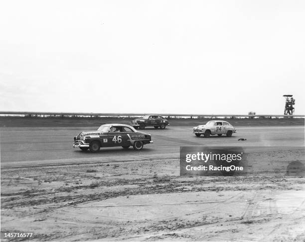 September 1, 1952: Action during the Southern 500 NASCAR Cup race at Darlington Raceway has Bob Pronger in a 1952 Oldsmobile leading a pair of 1951...