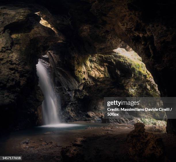 scenic view of waterfall in cave,sangineto,cosenza,italy - calabria foto e immagini stock