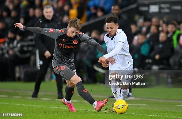 George Tanner Fin Stevens of Swansea City George Tanner of Bristol City during the ...