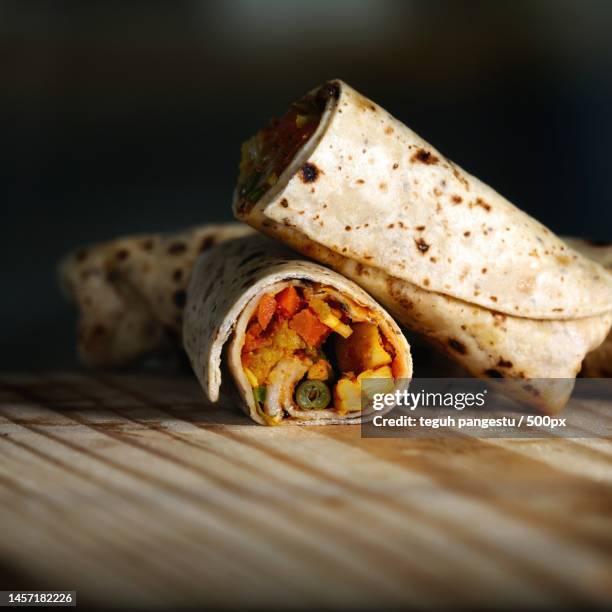close-up of food on cutting board,indonesia - burrito stock pictures, royalty-free photos & images