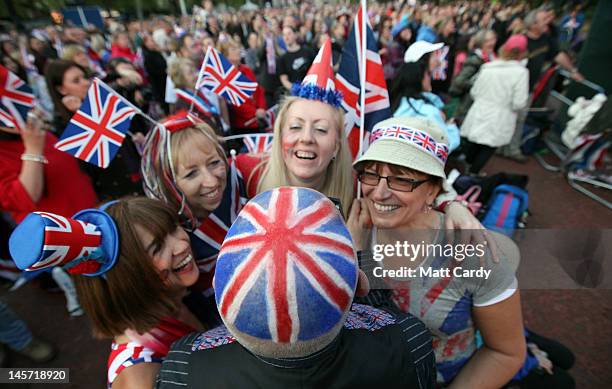 Diamond Jubilee revelers wear the Union Jack in the Mall during the entertainment at the Buckingham Palace Concert on June 4, 2012 in London,...