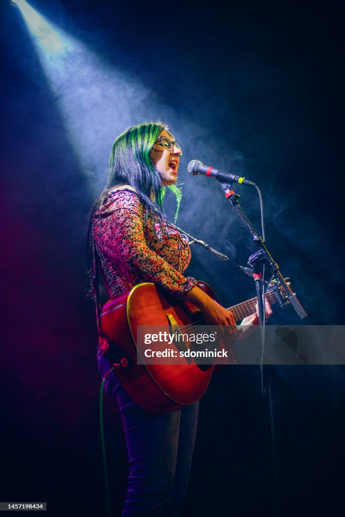 Young Woman Singer Under The Spotlight