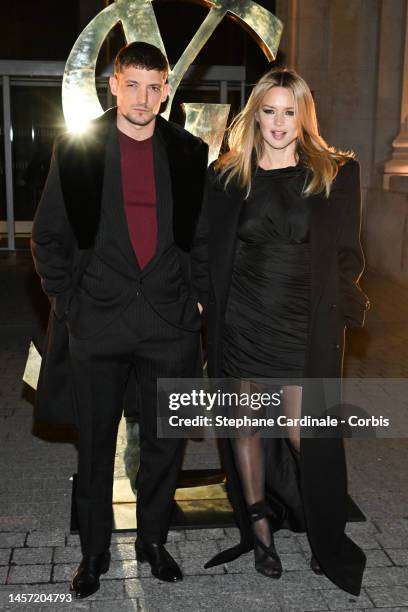 Niels Schneider and Virginie Efira attend the Saint Laurent Menswear Fall-Winter 2023-2024 show as part of Paris Fashion Week on January 17, 2023 in...