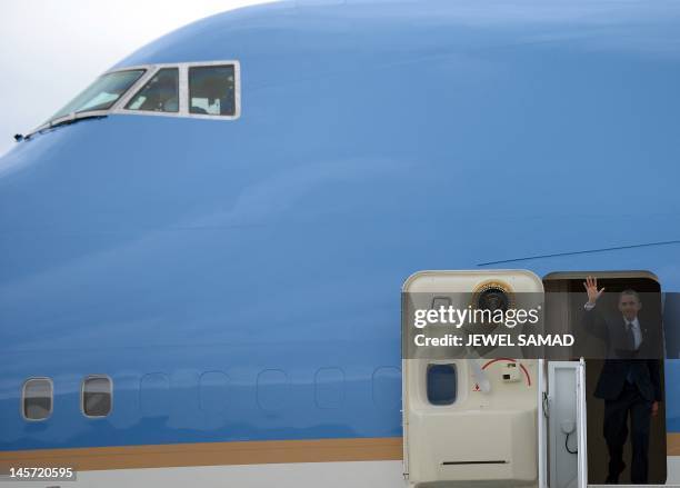 President Barack Obama disembarks from Air Force one at the John F. Kennedy International Airport in New York on June 4, 2012 as he arrives to attend...