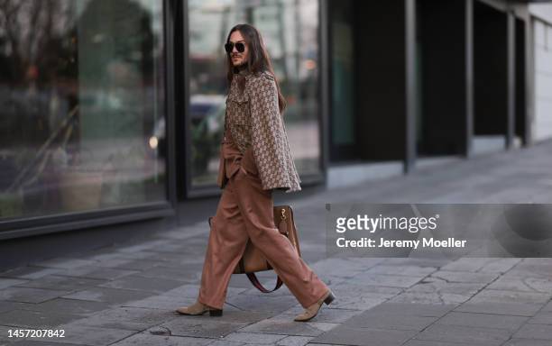 Riccardo Simonetti seen wearing brown Gucci round shades, Gucci beige brown logo cape and Gucci beige brown big bag, Asos brown wild leather matching...