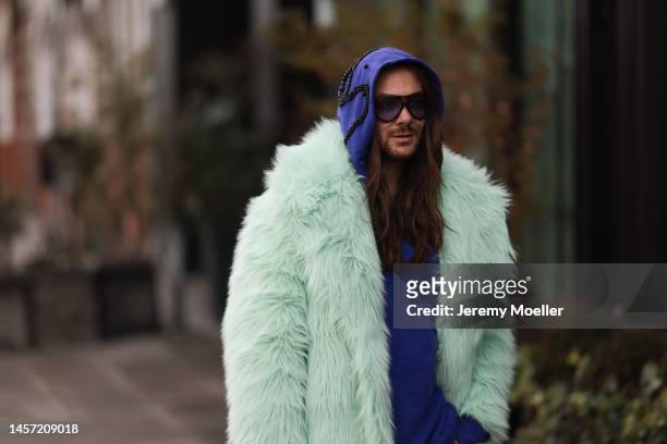 Riccardo Simonetti seen wearing Gucci green yellow and red bag and white Gucci sneaker, Tom Ford brown round shades, H&M Metaverse fur collection...