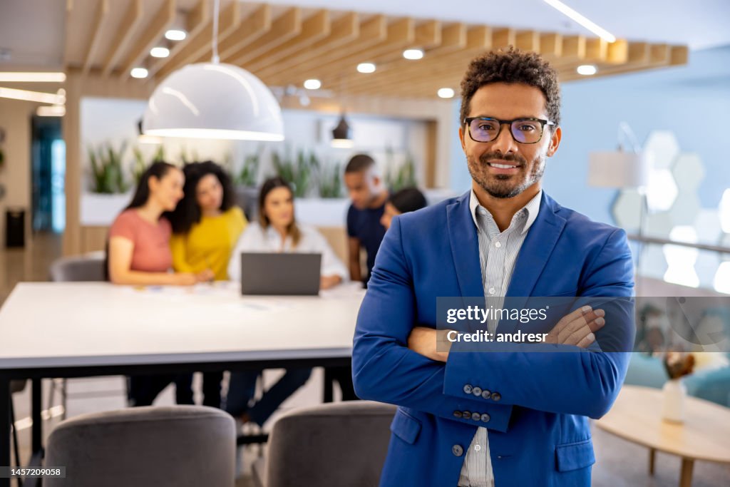 Portrait of a business man working at a coworking office