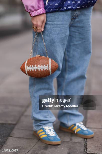 Riccardo Simonetti seen wearing Gucci x Adidas blue sneaker & Gucci x Adidas pink red and blue basketball jacket, Carhartt denim blue jeans, Acne...