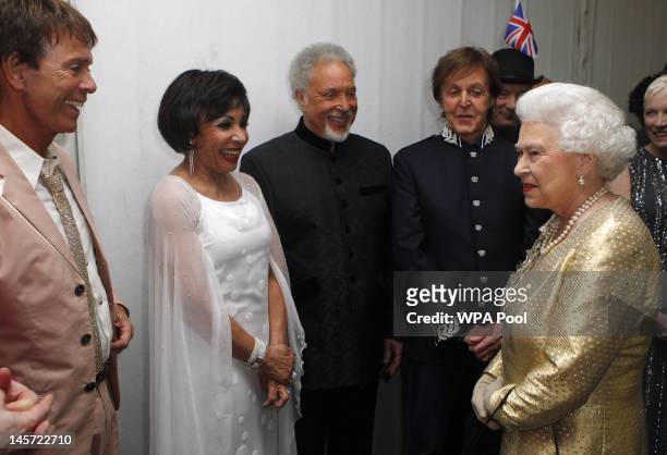 Queen Elizabeth II meets performers Sir Cliff Richard, Dame Shirley Bassey, Sir Tom Jones and Sir Paul McCartney backstage after the Diamond Jubilee,...
