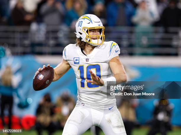 Quarterback Justin Herbert of the Los Angeles Chargers on a pass play during the AFC Wild Card Playoffs game against the Jacksonville Jaguars at TIAA...