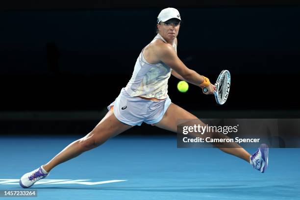 Iga Swiatek of Poland plays a backhand in their round two singles match against Camila Osorio of Colombia during day three of the 2023 Australian...