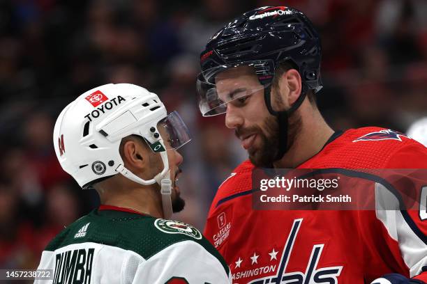 Tom Wilson of the Washington Capitals sticks out his tongue at Matt Dumba of the Minnesota Wild during the second period at Capital One Arena on...