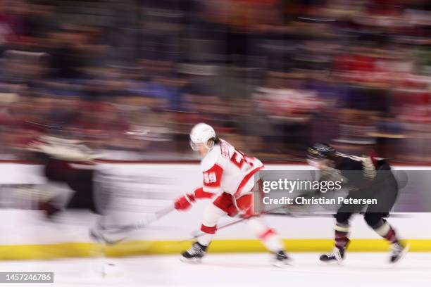 Tyler Bertuzzi of the Detroit Red Wings skates with the puck during the first period of the NHL game against the Arizona Coyotes at Mullett Arena on...