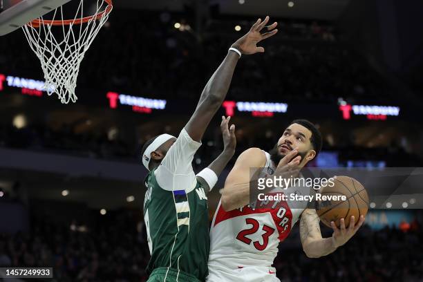 Fred VanVleet of the Toronto Raptors is defended by Bobby Portis of the Milwaukee Bucks during the second half of a game at Fiserv Forum on January...