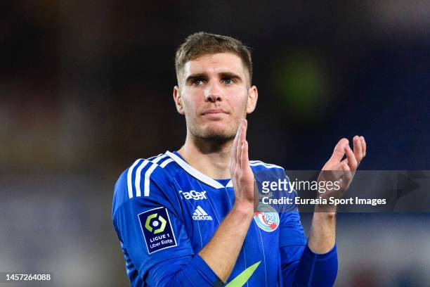 Maxime Le Marchand of RC Strasbourg thanks supporters for standing during the Ligue 1 match between RC Strasbourg and RC Lens at Stade de la Meinau...