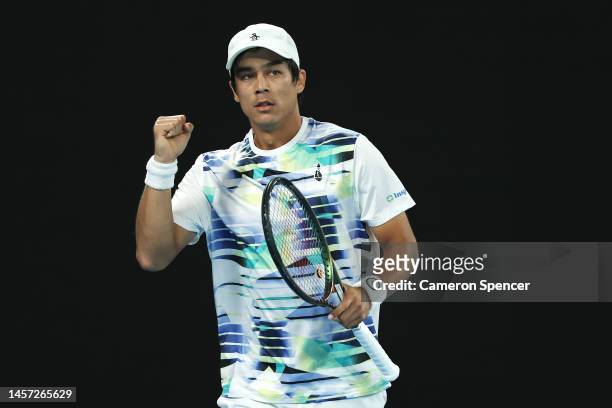 Mackenzie McDonald of the United States celebrates winning set point in their round two singles match against Rafael Nadal of Spain during day three...