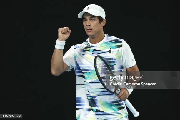 Mackenzie McDonald of the United States celebrates winning set point in their round two singles match against Rafael Nadal of Spain during day three...