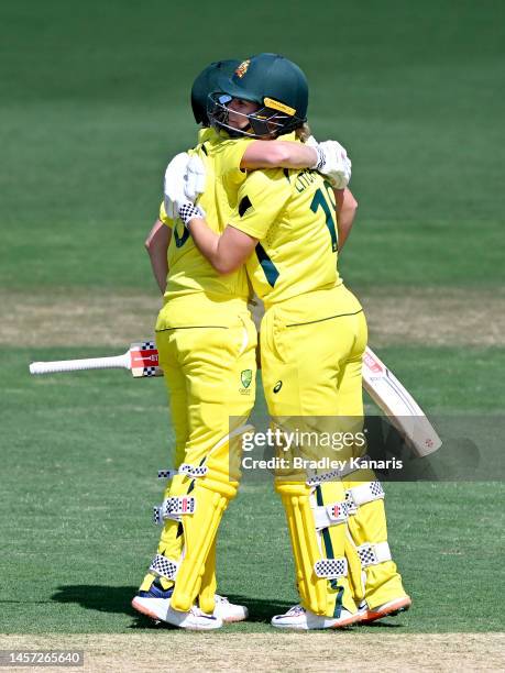 Beth Mooney and Phoebe Litchfield of Australia embrace as they celebrates victory after game two of the Womens One Day International series between...