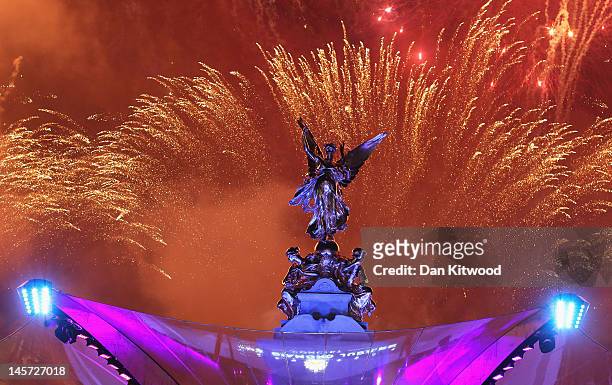 Fireworks illuminate the sky over the Queen Victoria memorial after the Diamond Jubilee concert at Buckingham Palace on June 4, 2012 in London,...