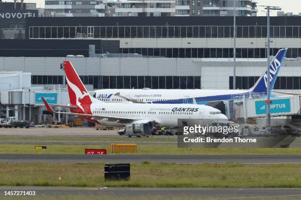 Qantas flight QF144 berths at a gate at Sydney Airport on January 18, 2023 in Sydney, Australia. Emergency services were on standby at Sydney Airport...