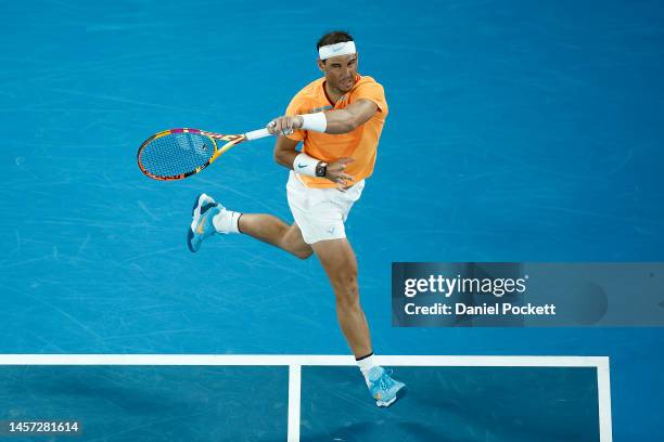 Rafael Nadal of Spain plays a forehand in their round two singles match against Mackenzie McDonald of the United States during day three of the 2023...